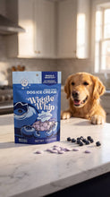 Load image into Gallery viewer, Dog ice cream package on a kitchen counter with a dog looking on