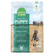 A bag of Open Farm Grain-Free Puppy Dry Dog Food featuring chicken, pork, and salmon ingredients.